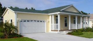 Skyline Manufactured Home with Full Front Porch and on site contractor on site attached garage.